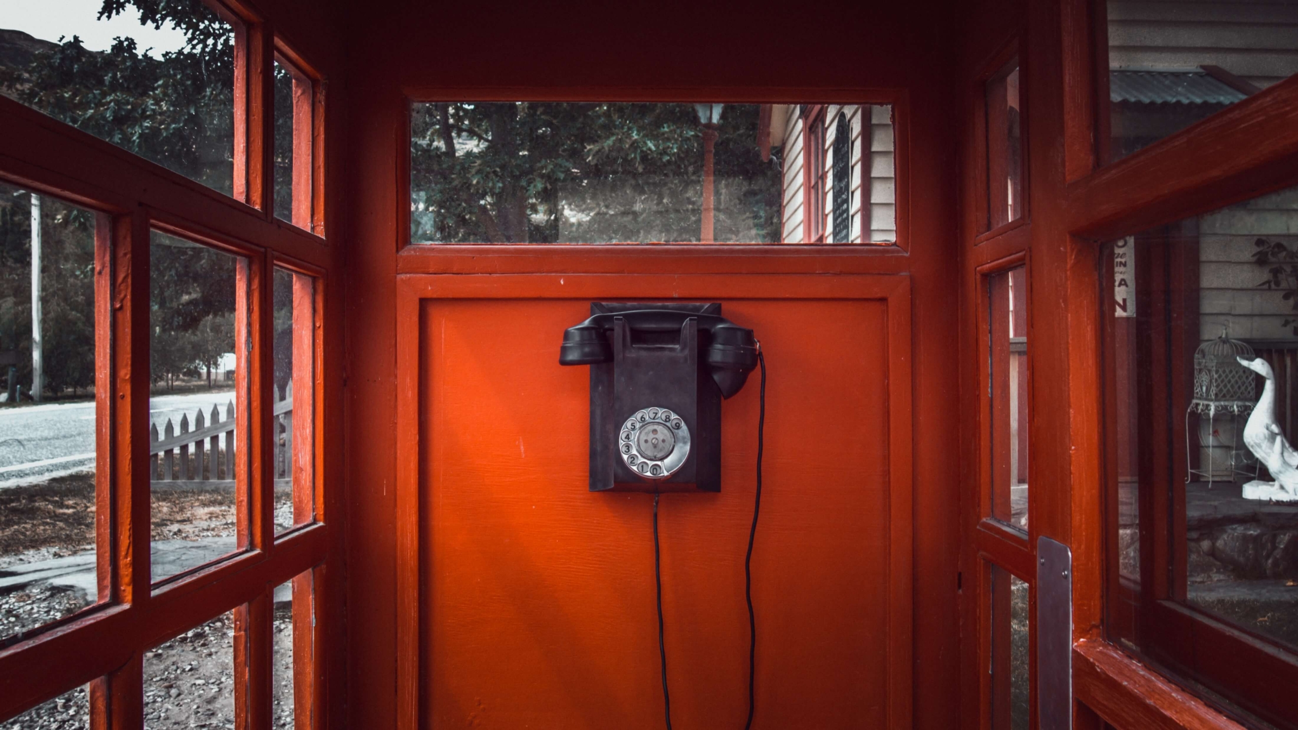 A vintage telephone booth with a rotary dial